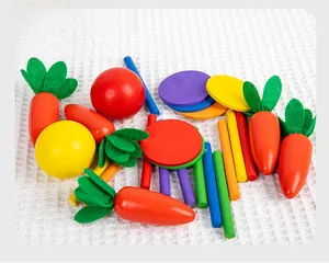 Detailed close-up of colorful wooden vegetable blocks and water-based paint finish