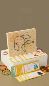 Close-up of wooden geoboard set with colorful rubber bands and geometric challenge cards