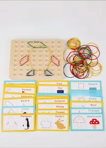 Detail of wooden geoboard set with colorful rubber bands and educational cards