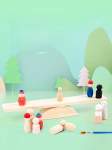 Close-up of wooden balance people figures with DIY painting brush and rocker base