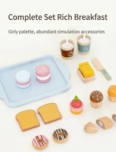 Macro shot of wooden play food set with macarons, donuts and tea cups on blue tray