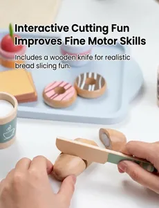 Detail showing hands using a wooden toy knife to slice a play croissant on a tray