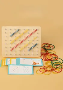 Detail of wooden geoboard with colored rubber bands and geometric instructional cards
