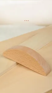 Macro detail showing smooth natural wood grain and joint structure of balance blocks