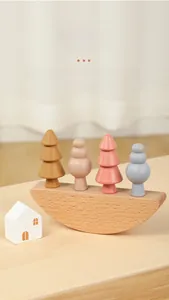 Close-up of wooden rainbow balancing blocks with colorful shapes on a semi-circular base