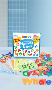 Close-up of 52 colorful magnetic letters and English word flashcards for early education