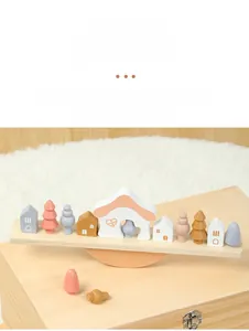 Detailed view of Morandi color wooden balance blocks on a natural timber base