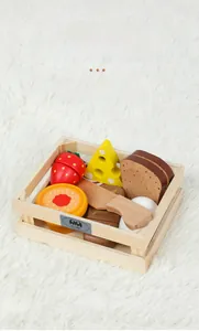 Detail of wooden storage basket with realistic play food models on a white plush surface