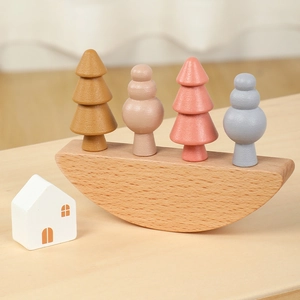 Montessori wooden rainbow balance blocks with semi-circle base and soft pastel tree shapes