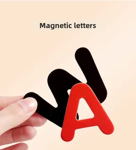 Close-up of educational magnetic alphabet letters showing the black magnetic backing detail
