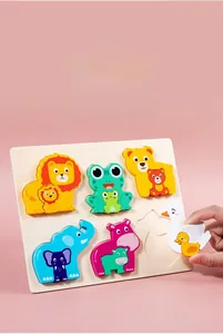 Detail of thick wooden animal puzzles for toddlers featuring easy-to-grasp lion and elephant