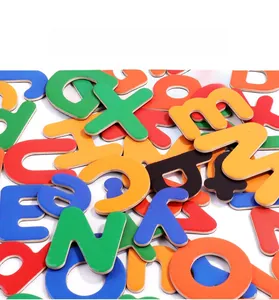 Macro shot of colorful magnetic alphabet wooden letters for English spelling and early learning
