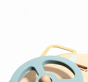 Close-up of rounded wooden steering wheel toy with smooth matte finish and eco-friendly wood