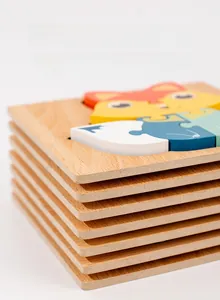 Close-up of thick wooden puzzle pieces with smooth rounded edges and colorful fox print
