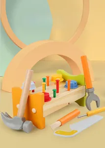 Close-up of wooden workbench toy set with colorful tools for fine motor skills training