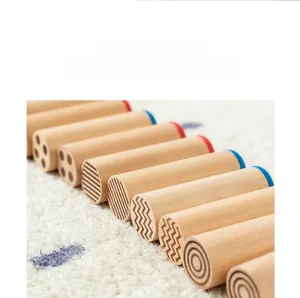 Detail of Montessori sensory cylinders with laser-engraved textures on wooden bases