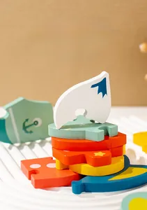 Close-up of colorful wooden puzzle blocks with ocean patterns on a textured tray