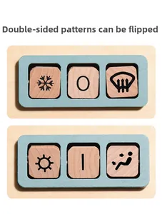 Close-up of double-sided reversible wooden blocks with weather and power icons