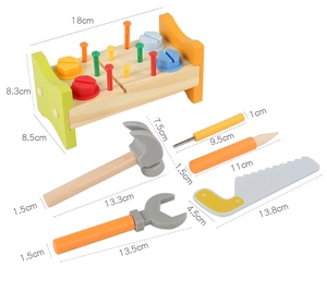 Detailed view of the wooden workbench toy with dimensions of tools and base