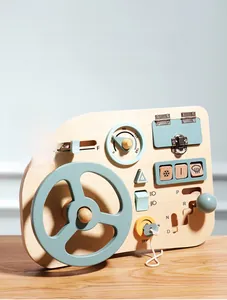 Close-up of wooden Montessori busy board with steering wheel and gear shift levers