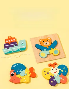 Detail of colorful wooden animal puzzles featuring ship, butterfly, fish and bear shapes