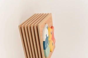 Macro view of multi-layered wooden animal puzzles with smooth edges and natural texture