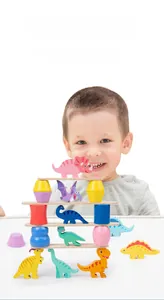Close-up of wooden dinosaur stacking blocks being played by a child for balance training