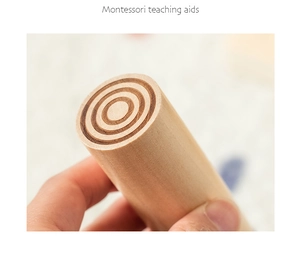 Close-up of Montessori wooden cylinder with engraved concentric circles for sensory training