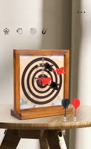 Close-up of dual-sided magnetic dartboard with solid wood frame and six safety darts