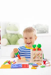 Detail of 8-in-1 Montessori wooden toy showing carrot harvest and magnetic fishing games