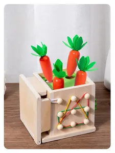 Detail of wooden Montessori toy with carrot harvest game and colorful elastic bands
