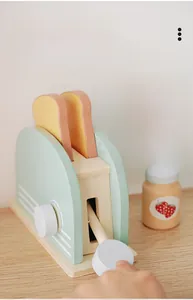 Detail of wooden toaster toy with adjustable knob, strawberry jam, and slices of toast