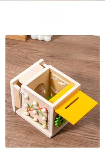 Close-up of 8-in-1 Montessori wooden activity box with removable yellow game board