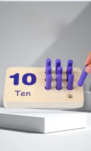 Close-up of wooden math learning board with ten purple pegs for number ten recognition