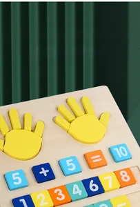 Detail of wooden finger arithmetic toy showing yellow hands and colorful number blocks