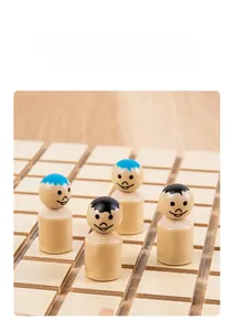 Detailed close-up of polished smooth wooden figures with blue and black hair prints