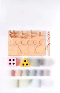Detail view of wooden Montessori 3-in-1 set with magnetic fish and geometric shape blocks