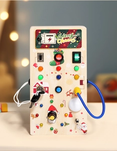 Macro shot of wooden sensory busy board with colorful LED lights and Christmas patterns