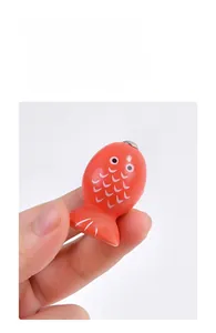 Close-up of polished red wooden fish block with smooth edges for kids safe playing