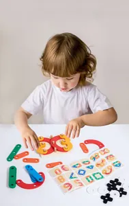 Detailed macro view of colorful wooden geometric blocks and logical training manual