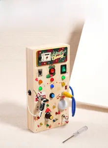 Macro detail of wooden Christmas busy board with colorful LED lights and power switches