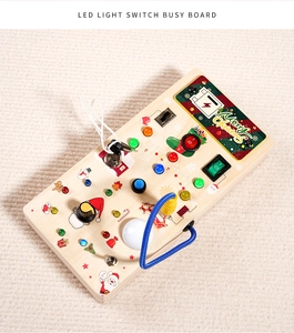 Detail of Christmas Montessori busy board with LED lights and wooden toggle switches