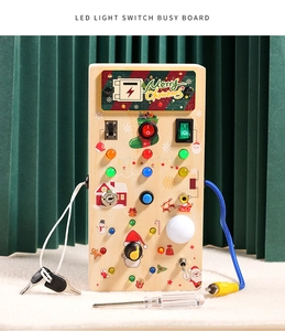 Close-up of wooden Montessori busy board with LED light switches and Christmas theme