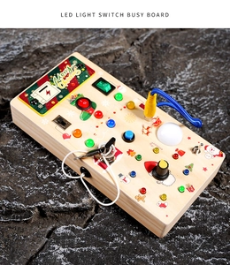 Close-up of wooden Montessori busy board with LED light switches and Christmas theme