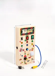 Detail view of wooden Christmas busy board with LED lights and switches showing dimensions