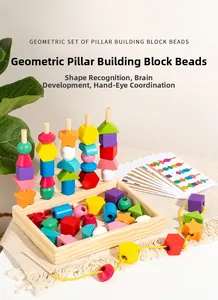 Close-up of colorful wooden geometric blocks with challenge cards and lacing thread
