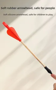 Detail view of the soft silicone safety tip on a traditional wooden toy arrow
