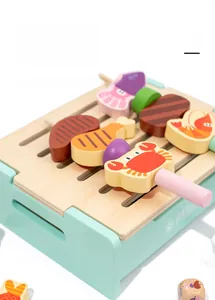 Close-up of wooden BBQ grill toy base and assorted skewers for role-playing games