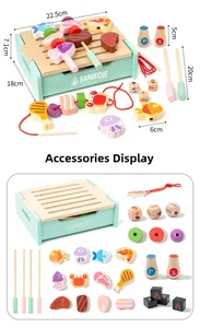 Detailed view of kids wooden BBQ play set parts including grill base and food accessories