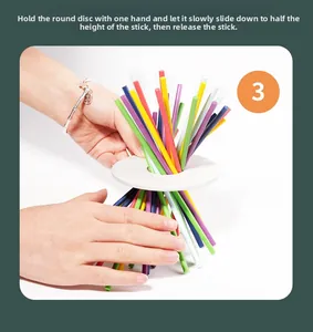 Detail showing the colorful wooden sticks and white ring for sensory motor training